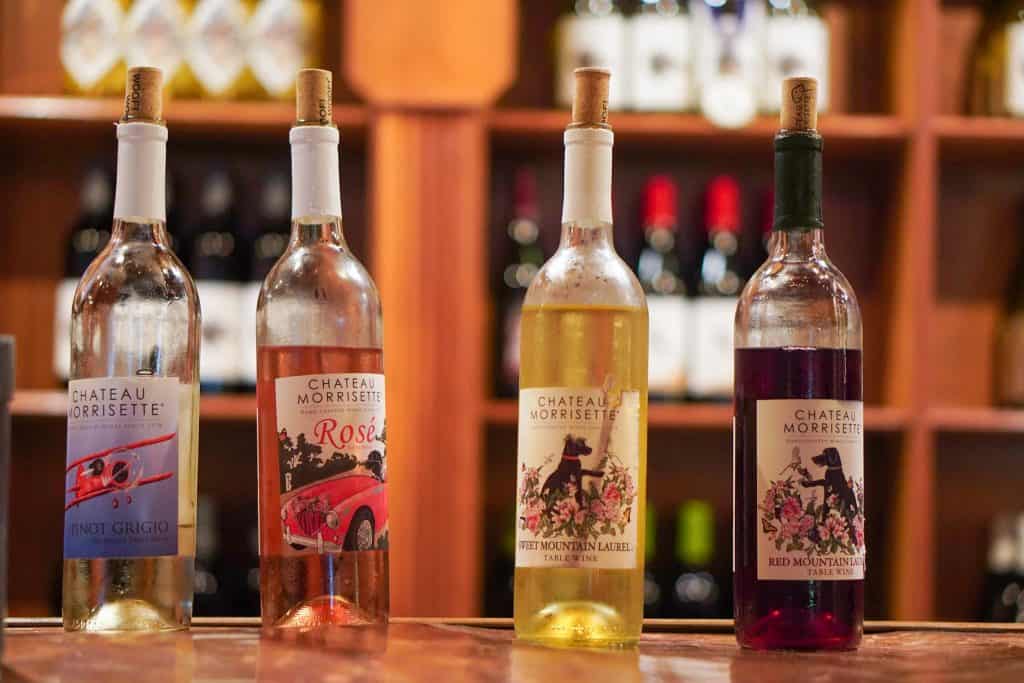 Four bottles of wine from Chateau Morrisette, featuring Pinot Grigio, Rosé, Sweet Mountain Laurel, and Red Mountain Laurel.